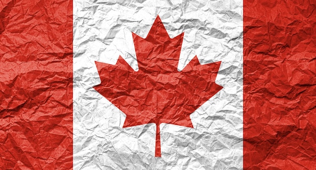 Premium Photo | Flag of canada on crumpled paper textured background