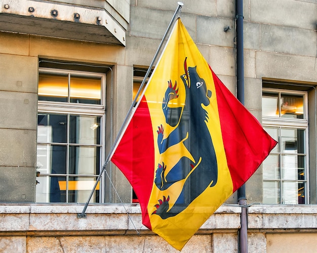 Flag of canton Bern in the building on Kramgasse street in Bern, Switzerland