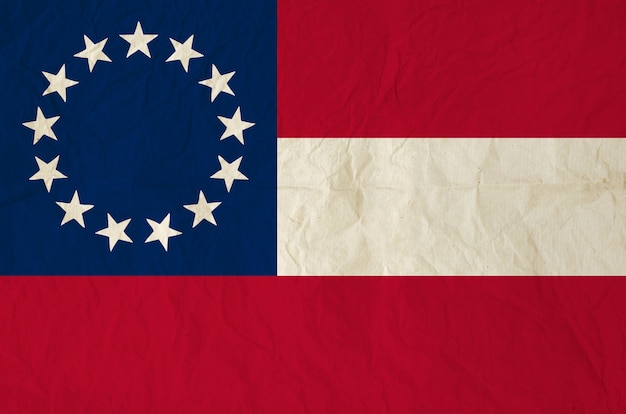 Flag of the Confederate States of America with old vintage paper texture
