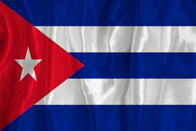 The flag of Cuba on a silk background is a great national symbol Fabric texture The official state symbol of the country