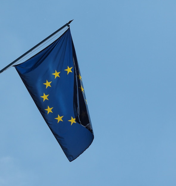 Flag of the European Union (EU) over blue sky