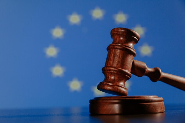 Flag of European Union and wooden judge gavel concept picture about law and justice