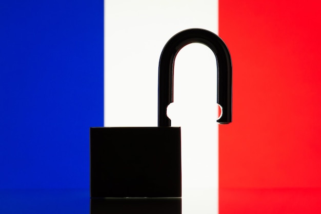 Flag of France with silhouette of lock on the foreground