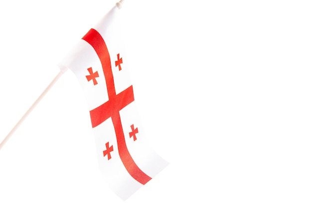 The flag of georgia on a white background develops and flies waving in the wind isolate