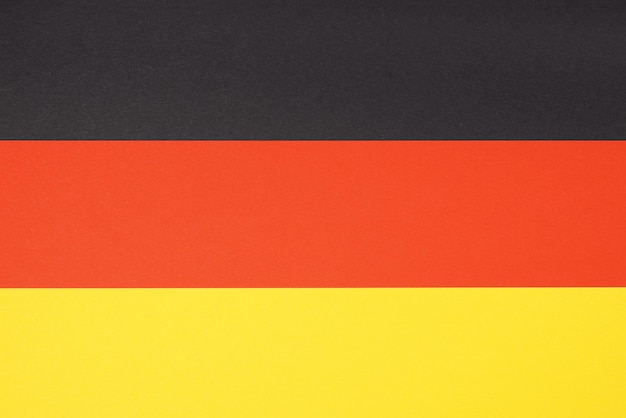 Photo flag of germany made from paper in black red and yellow or gold