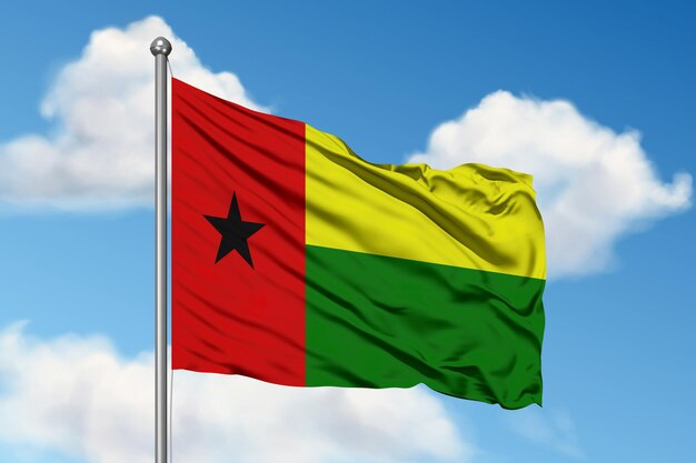 A flag of ghana is waving in the sky.