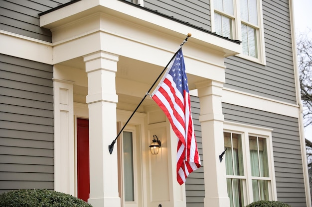 A flag hangs from a porch