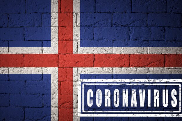 Flag of the Iceland with original proportions. stamped of Coronavirus. brick wall texture. Corona virus concept. On the verge of a COVID-19 or 2019-nCoV Pandemic.