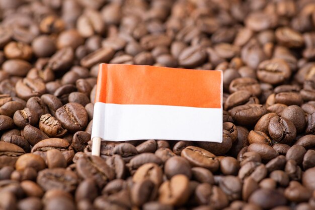 Flag of Indonesia on roasted coffee beans