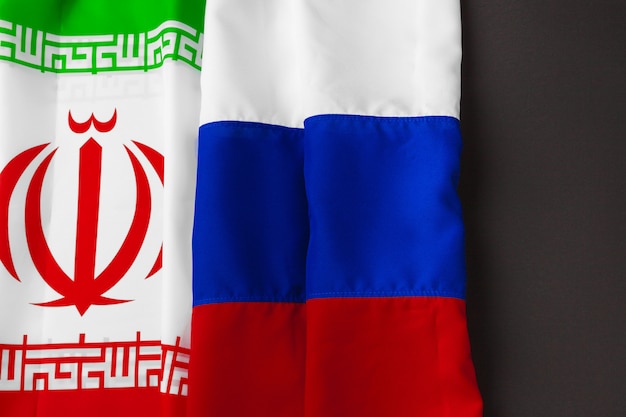 Flag of Iran and Russia together on black