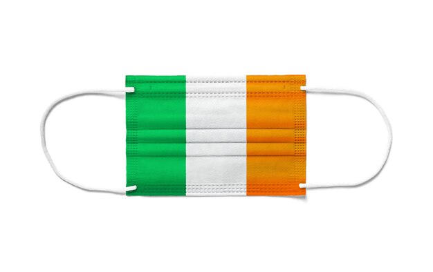 Flag of Ireland on a disposable surgical mask. White background isolated