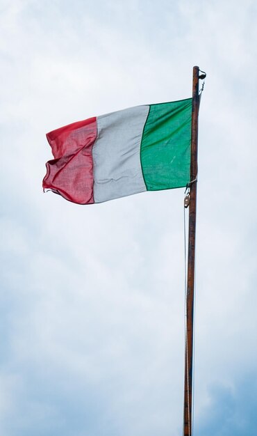 Flag of italy on sky background