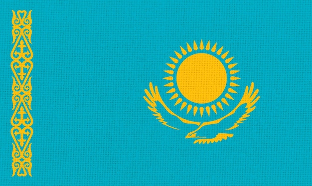 Photo flag of kazakhstan national kazakh flag on fabric surface asian country