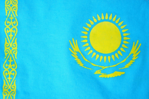 Flag of Kazakhstan with the scorching sun and soaring Golden eagle.