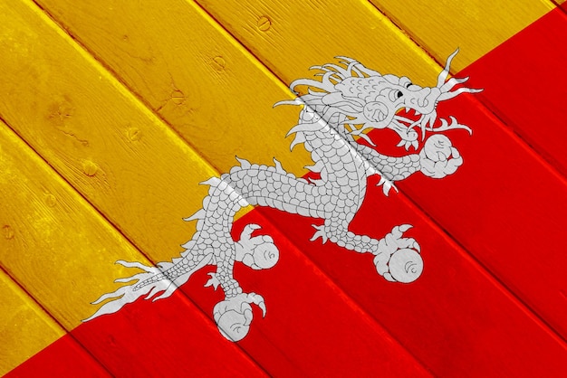 Photo flag of kingdom of bhutan on a textured background concept collage