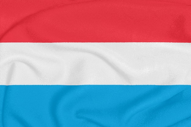 Flag of Luxembourg on textured fabric.