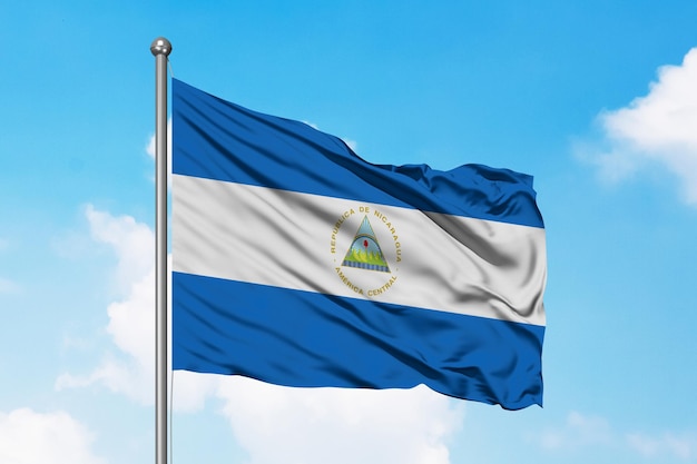 Premium Photo | Flag of nicaragua in sky