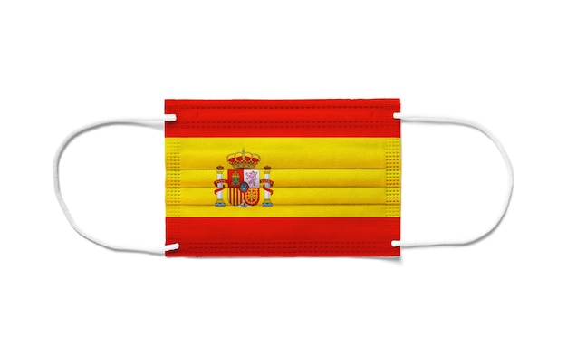 使い捨てサージカルマスクのスペイン国旗。分離された白い背景