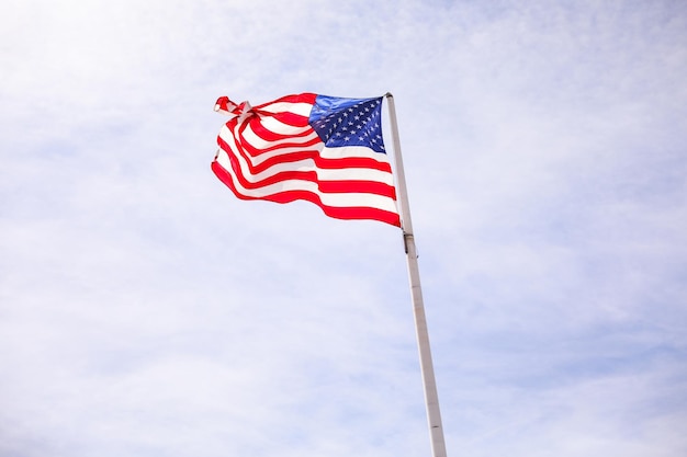 A flag on a pole with the american flag on it