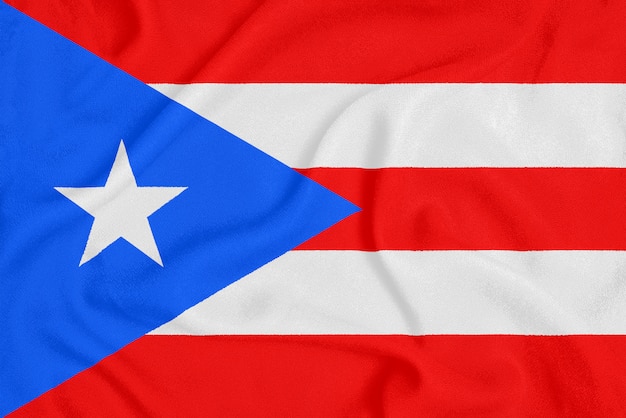 Flag of Puerto Rico on textured fabric. Patriotic symbol