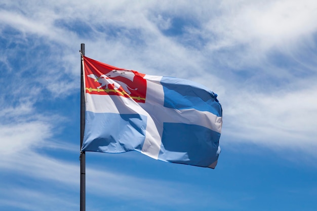 Flag of Saint Malo waving in mid air