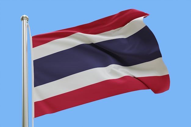 Flag of Thailand on flagpole waving in the wind isolated on blue background