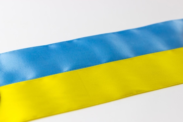 Flag of Ukraine from satin ribbons stripes of blue and yellow colors