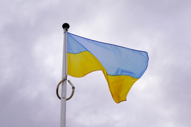 Flag ukraine yellow blue Ukrainian national official on dark cloud sky background