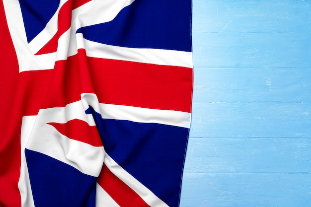 Flag of United Kingdom on wooden background, copy space