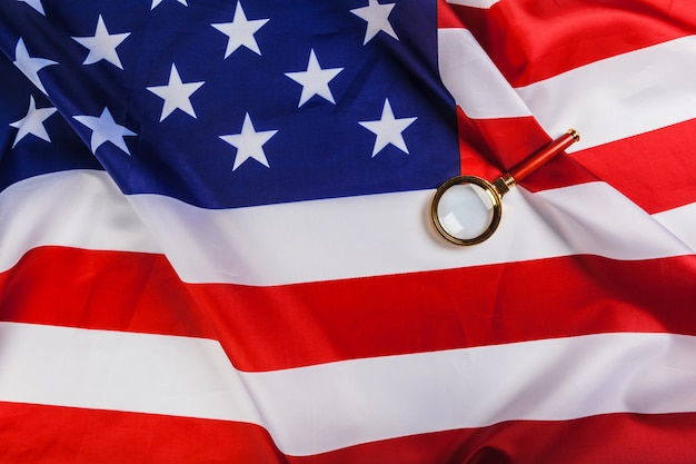 Flag of USA and a magnifying glass