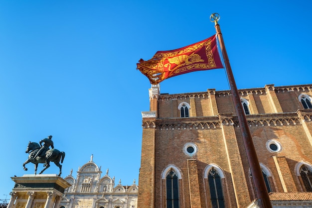 Flag of Venice near the Basilica di San Giovanni e Paolo in Venice Italy