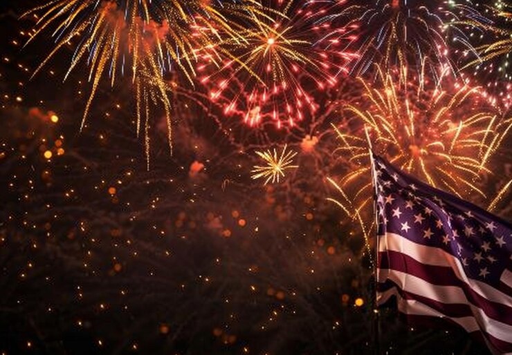 a flag with a flag and a flag with fireworks behind it