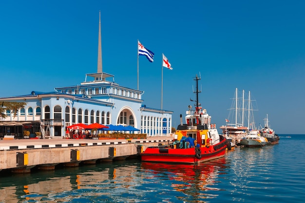 Flags of Adjara and Georgia and boats in the Batumi Sea Port Adjara Georgia