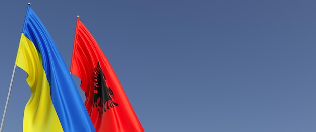 Flags of Albania and Ukraine on flagpoles on the sides Flags on a blue background Place for text Independent sovereign Ukraine Albanian flag Commonwealth 3D illustration