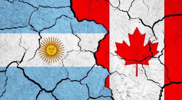 Flags of argentina and canada on cracked surface politics relationship concept