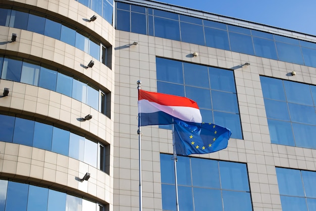 Flags of the EU and the Netherlands at the office building