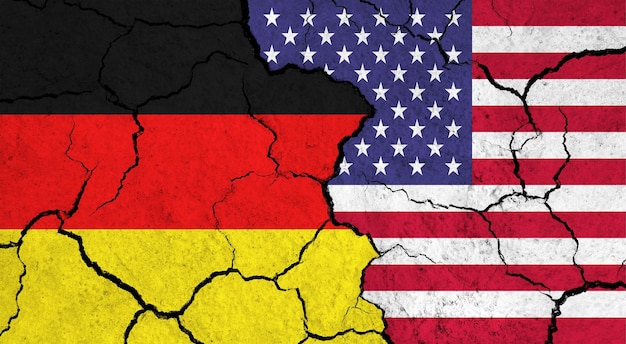 Flags of Germany and USA on cracked surface politics relationship concept