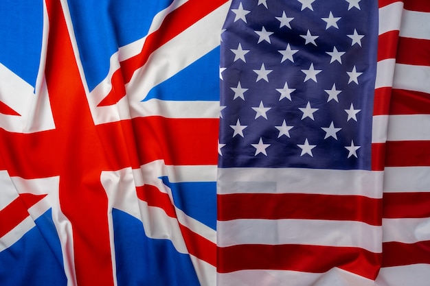 Flags of Great Britain and USA folded together close up