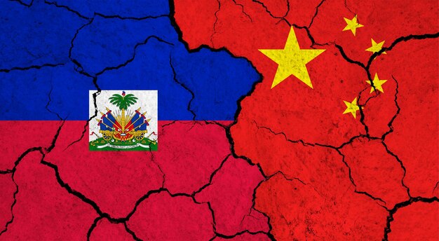 Flags of haiti and china on cracked surface politics relationship concept