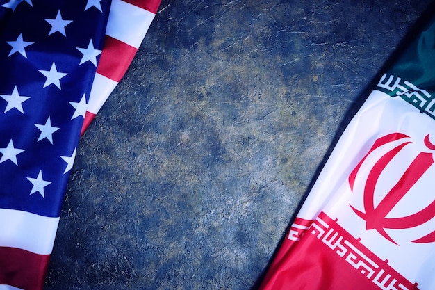 Premium Photo | Flags of Iran and United States of America are opposite