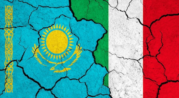 Flags of Kazakhstan and Italy on cracked surface politics relationship concept