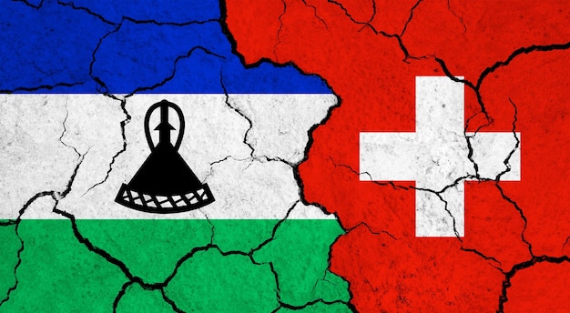 Flags of lesotho and switzerland on cracked surface politics relationship concept