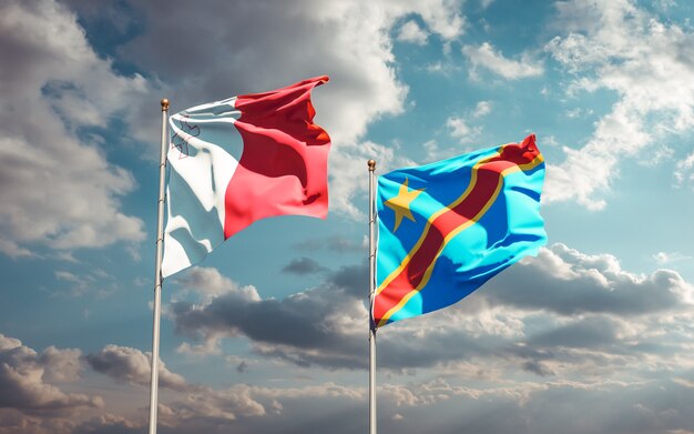 Flags of Malta and DR Congo on blue sky. 3D artwork