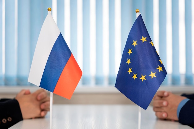Flags of russia and european union international negotiations\
conclusion of contracts between countries concept of communication\
between representatives of two countries geopolitica