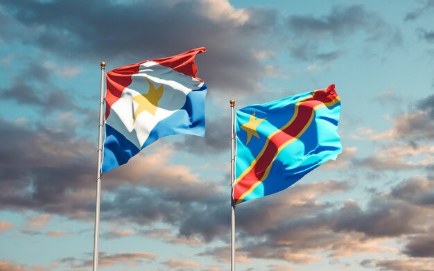 Flags of Saba and DR Congo on blue sky. 3D artwork