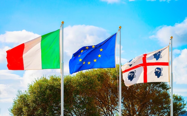 Flags of Sardinia, European Union and Italian flag, Costa Smeralda, Italy. Mixed media.