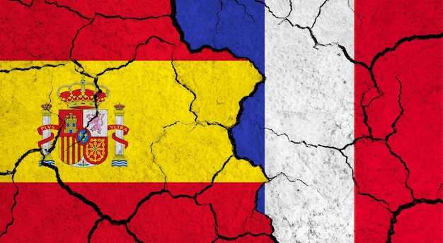 Flags of spain and france on cracked surface politics relationship concept