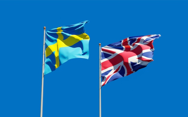 Flags of Sweden and Sweden on blue sky. 3D artwork