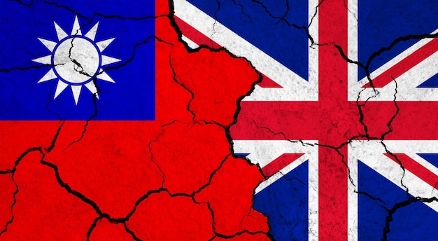 Flags of taiwan and united kingdom on cracked surface politics relationship concept