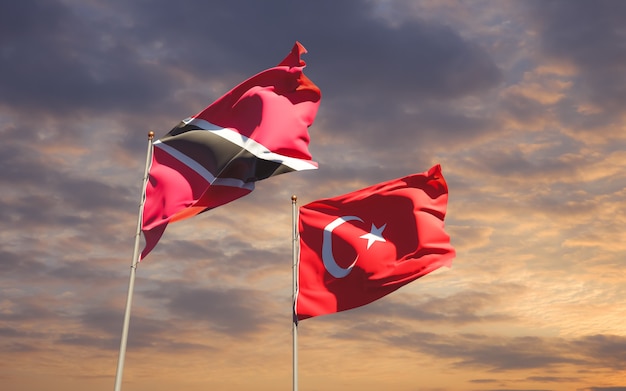 Flags of Trinidad and Tobago and Turkey on sky background